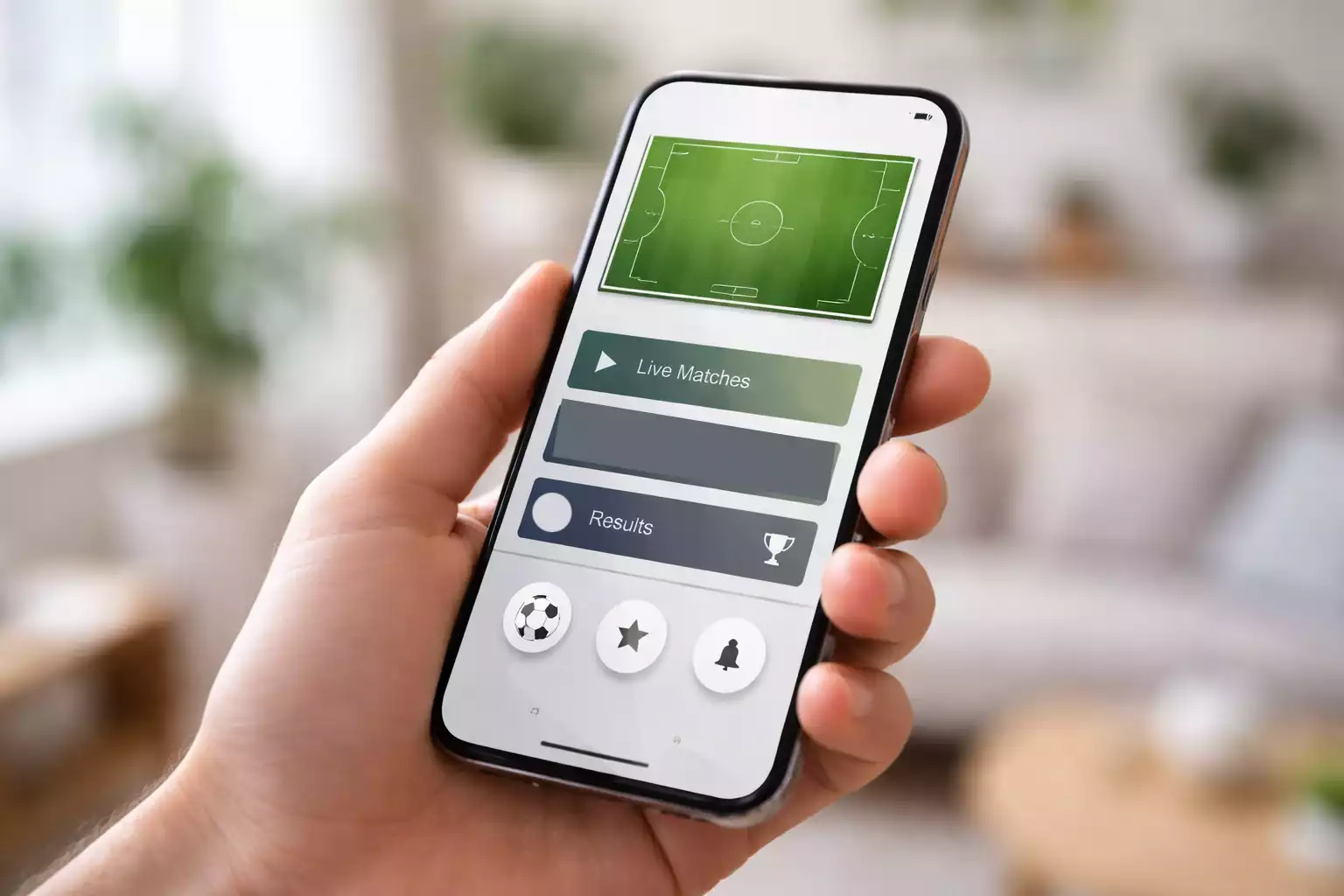 Moderne smartphone met voetbal app interface